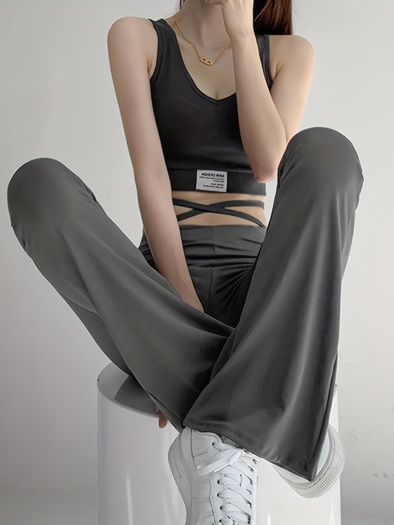 Solid Black High Waist Flare Leggings with Open Navel Criss Cross Straps - Body-Conforming & Fashion-Forward Wide Pants for Women