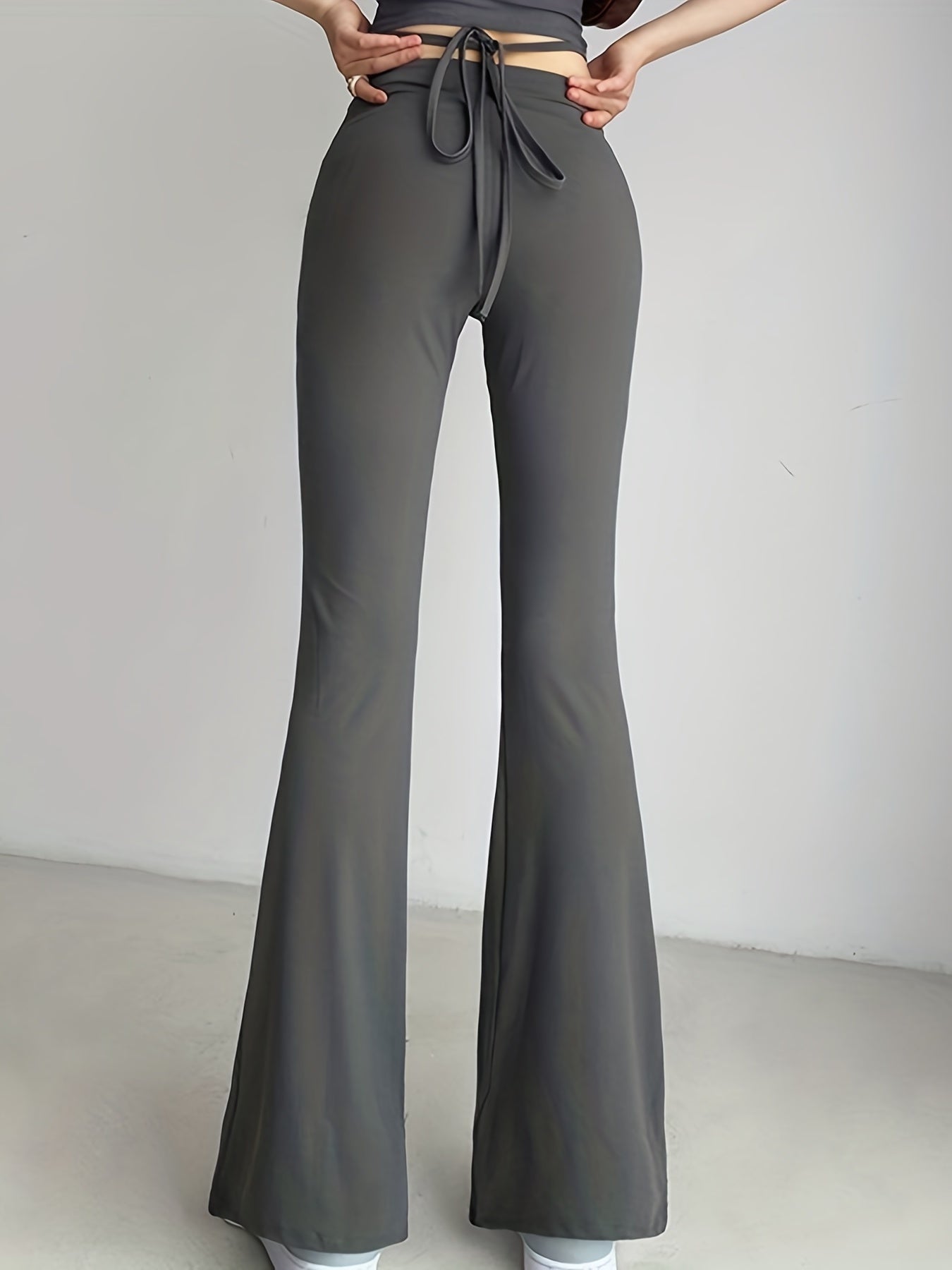 Solid Black High Waist Flare Leggings with Open Navel Criss Cross Straps - Body-Conforming & Fashion-Forward Wide Pants for Women