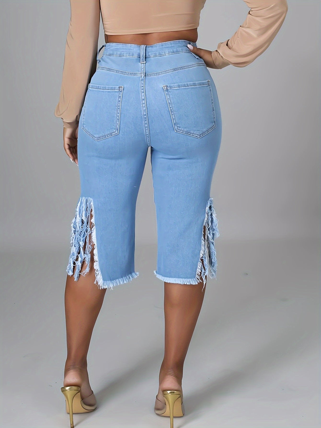 High-Stretch Womens Bermuda Denim Midi Shorts - Distressed Raw Fringe Hem, Ripped Split Details, Fashionable Summer Jeans Wear with Tassel Accents - Solid Color, No Printing, Casual Style, Woven Fabric