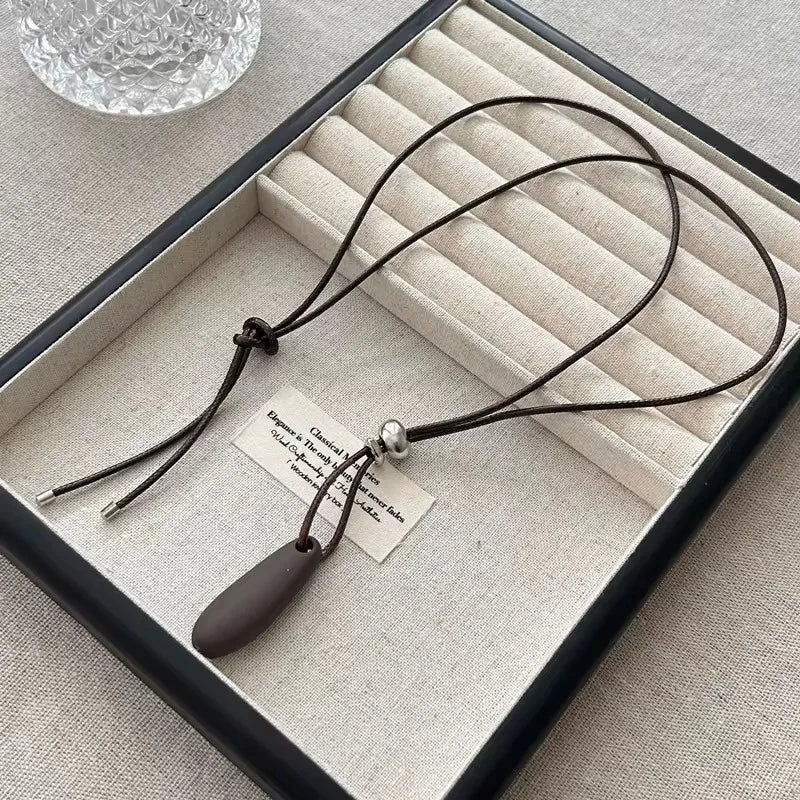 Ingvn  Metal Water Drop Shaped Pendant Necklace for Women Girls Simple Black Rope Adjustable Long Sweater Chain Fashion Accessory