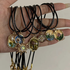 Ingvn  Vintage Drip Oil Flower Sun Pendant Necklace with Leather Rope Unique Antique Style Jewelry Accessory
