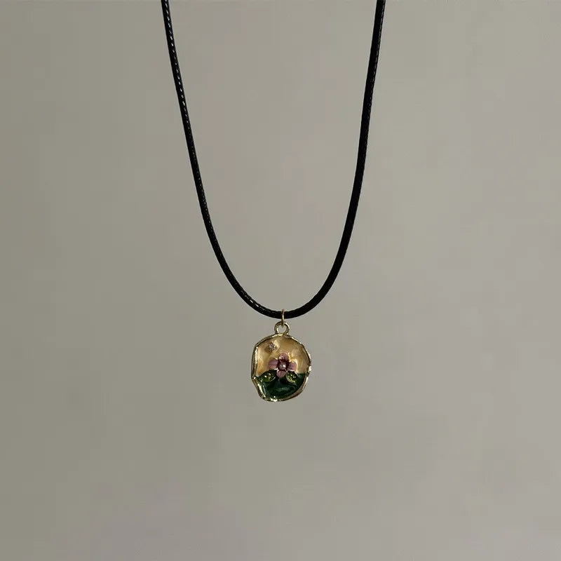 Ingvn  Vintage Drip Oil Flower Sun Pendant Necklace with Leather Rope Unique Antique Style Jewelry Accessory