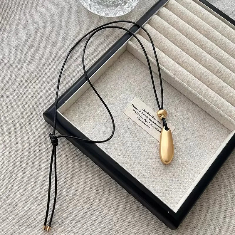 Ingvn  Metal Water Drop Shaped Pendant Necklace for Women Girls Simple Black Rope Adjustable Long Sweater Chain Fashion Accessory