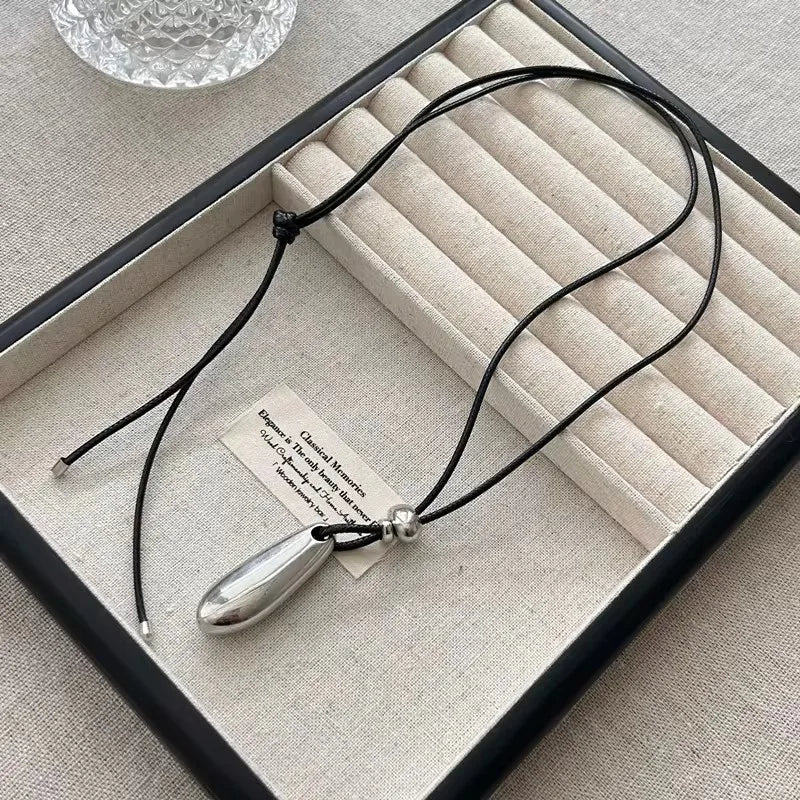 Ingvn  Metal Water Drop Shaped Pendant Necklace for Women Girls Simple Black Rope Adjustable Long Sweater Chain Fashion Accessory