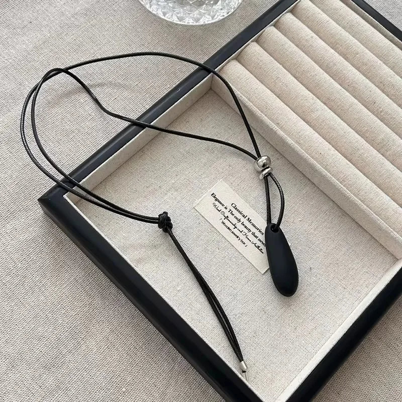 Ingvn  Metal Water Drop Shaped Pendant Necklace for Women Girls Simple Black Rope Adjustable Long Sweater Chain Fashion Accessory